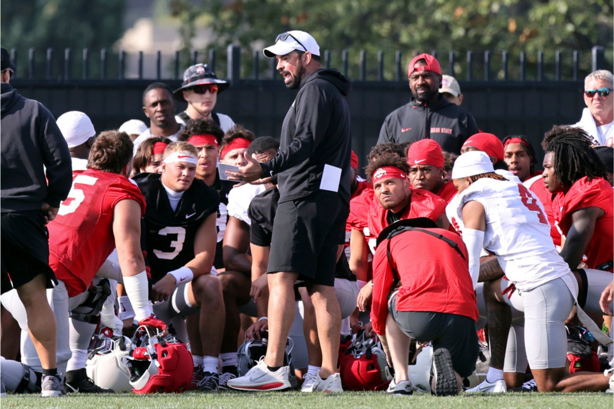 Ohio State coach Ryan Day talks to his team during NCAA college football practice