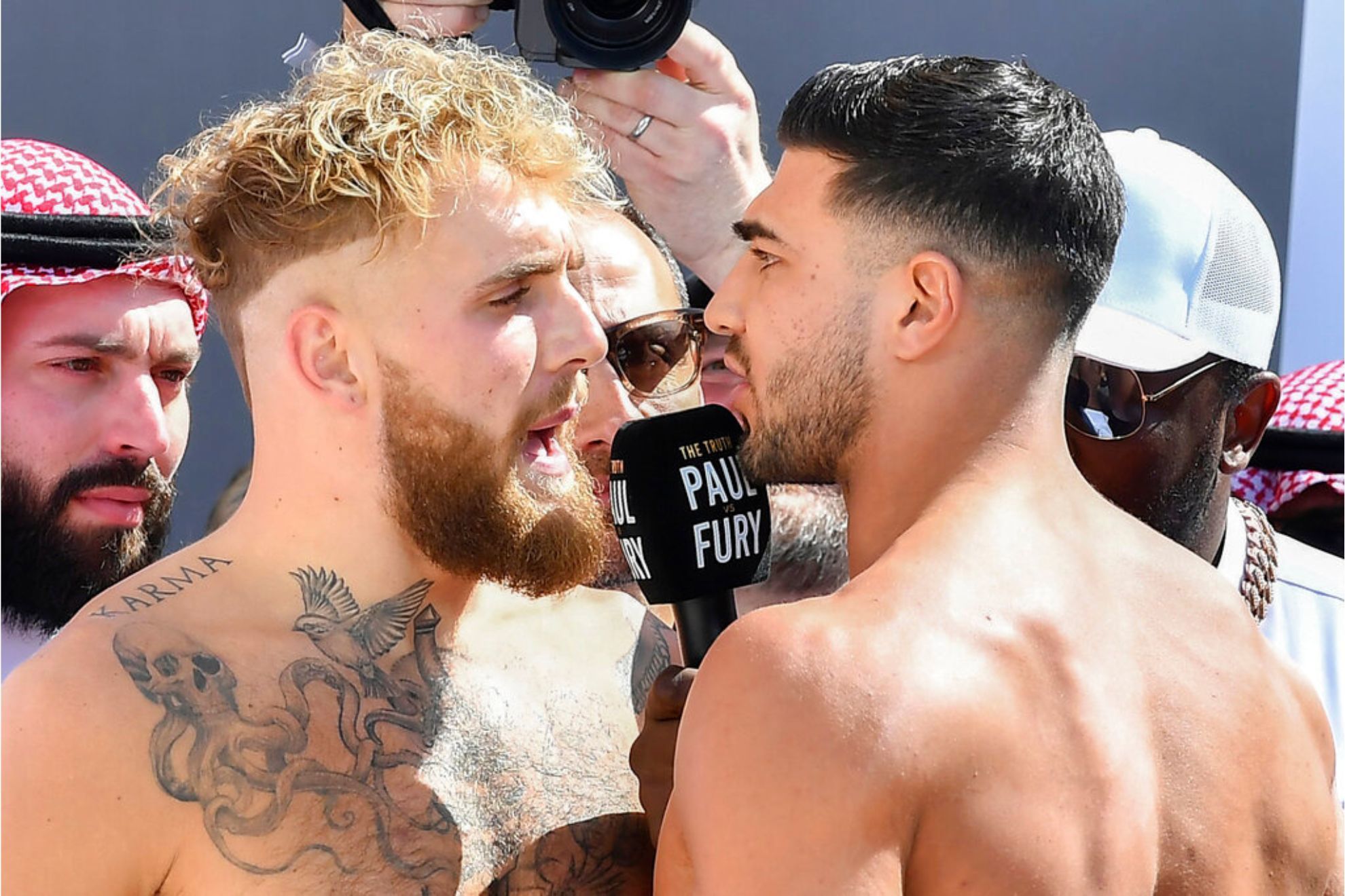 Jake Paul and Tommy Fury, face off after a weigh-in, a day before their match, in Riyadh, Saudi Arabia